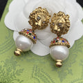 GUCCI LION HEAD PEARL COLORED DIAMOND EARRINGS