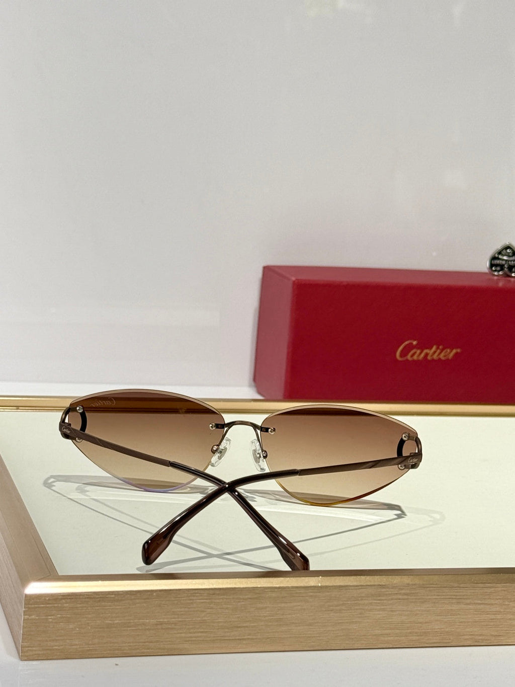 CARTIER C DE TRIANGLE FRAME SUNGLASSES CT0334S IN METAL