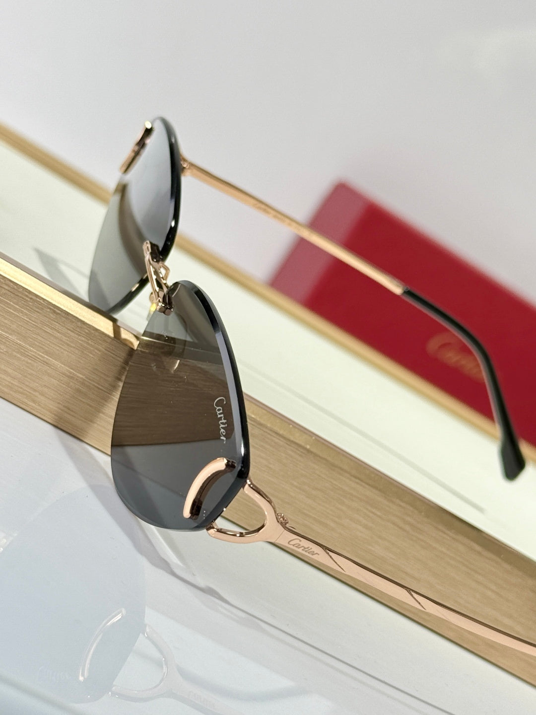 CARTIER C DE TRIANGLE FRAME SUNGLASSES CT0334S IN METAL