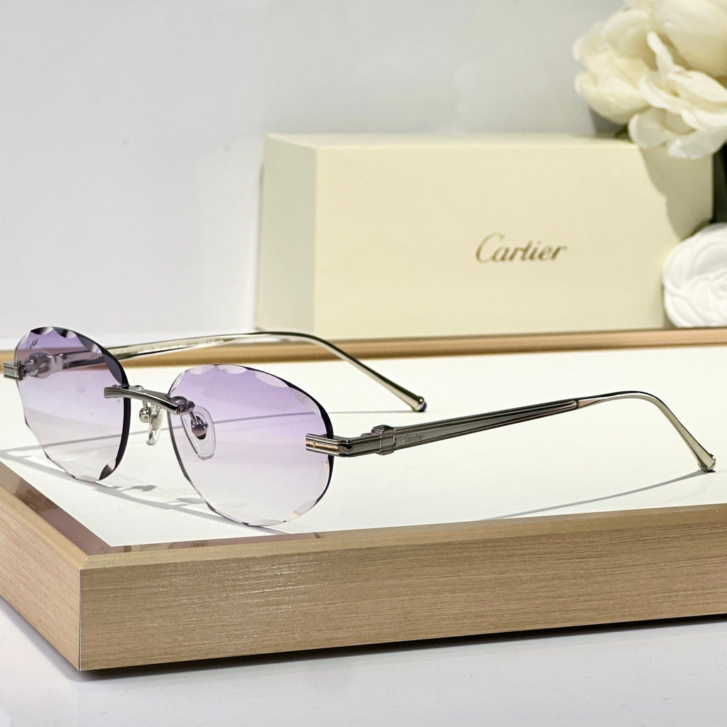 CARTIER C DE RIMLESS ROUND FRAME SUNGLASSES CT0611S IN METAL